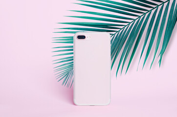 pink smart phone clear case mockup on a pink background of palm leaves silicone transparent case...