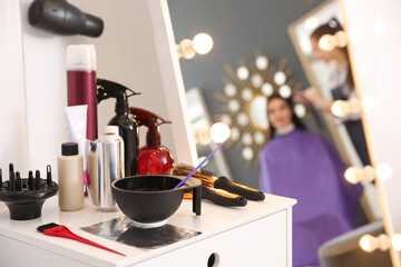 Workplace with hair dye kit in beauty salon