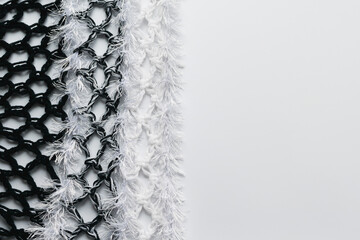 Knitted fabric with fringe on a decorative background