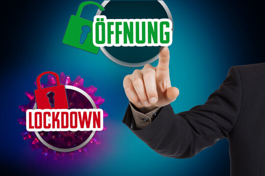Concept: Buttons with the Word Lockdown and the German word Oeffnung (reopen)
