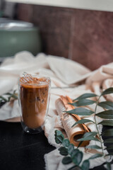 glass of coffee with milk on a white canvas
