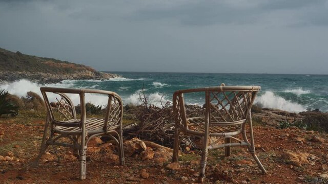 Two Wooden Chairs And Fireplace In Front Of The Ocean, Peloponnes, Greece