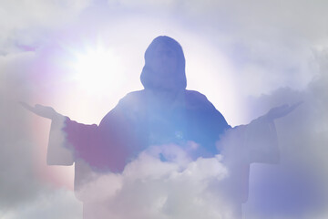 Silhouette of Jesus Christ and cloudy sky, double exposure