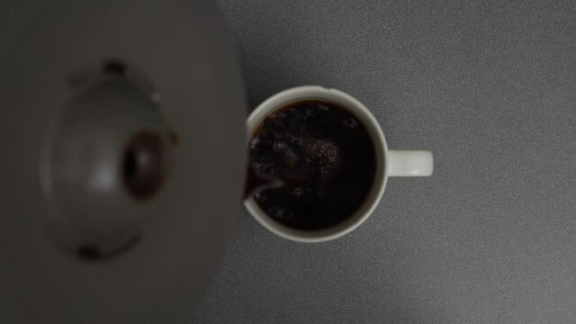 Coffee Carafe Pouring Coffee Into Mug Top Down Shot 4K.mp4