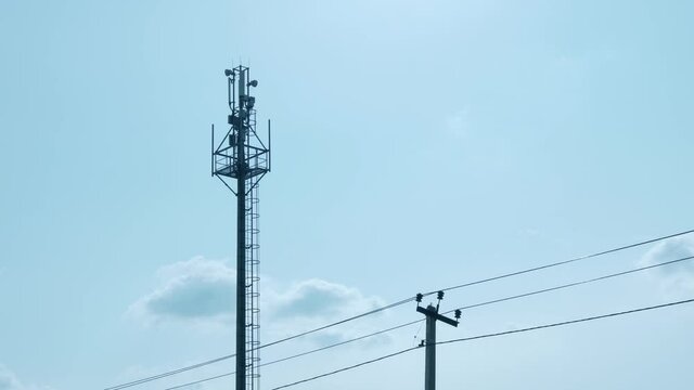 Mobile Communications, Cell Network Tower, Mobile Communications Equipment, Internet, Mobile Operators  Blye Sky and White Cloud In Clear Weather during The Day, Time Lapse.