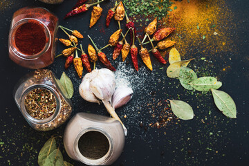 Kitchen colorful spices on black background