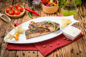 Fried fish carp on the grill
