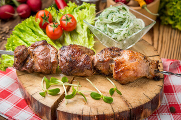 Delicious juicy skewered meat or shish kebabs on skewers of pork tenderloin