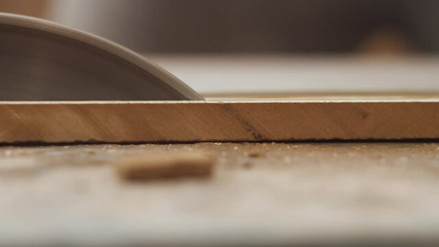Cutting ceramic bath tiles with an abrasive disc, closeup. Processing the tiles for the bathroom, cutting tile, in profile