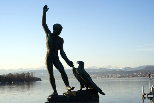 Ganymed bronze sculpture at B&uuml;rkliplatz, lake of Zurich. Man with eagle from the greek Mythology. Photo taken March 30th, 2021, Zurich, Switzerland.