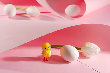 White egg with easter chicken on pink background. Easter spring holiday card