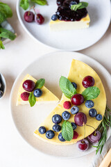 Vanilla no crust cheesecake or cottage cheese casserole decorated with mint and berries. Ricotta casserole. Healthy breakfast or dessert. Top view.