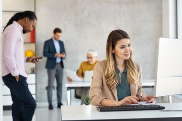 Happy business people working in office