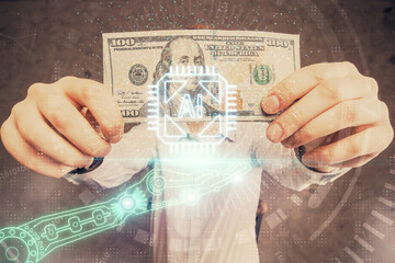 Double exposure of technology drawing hologram and us dollars bills and man hands. Data concept