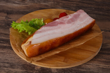 Smoked pork breast with salad leaves