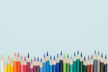 Colored pencils on a blue background