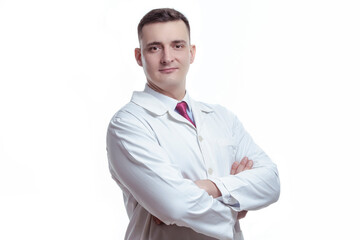 Medical Ideas and Concepts. Portrait of Confident Professional Male GP Doctor Posing in Doctor's Smock and Folded Hands on White Background.