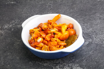 Marinated pickled honey mushrooms in the bowl