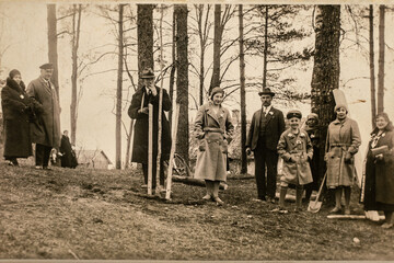 Latvia - CIRCA 1930s: People planting trees. Group photo in forest. Vintage archive Art deco era...