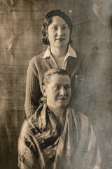 Germany - CIRCA 1930s: Close up portrait of two woman in studio, Vintage Art Deco era photo