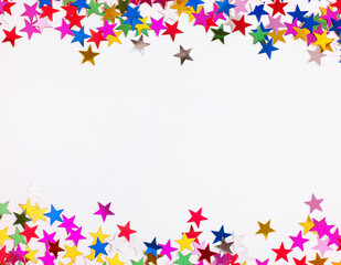 colorful confetti in the shape of a star scattered on a gray background