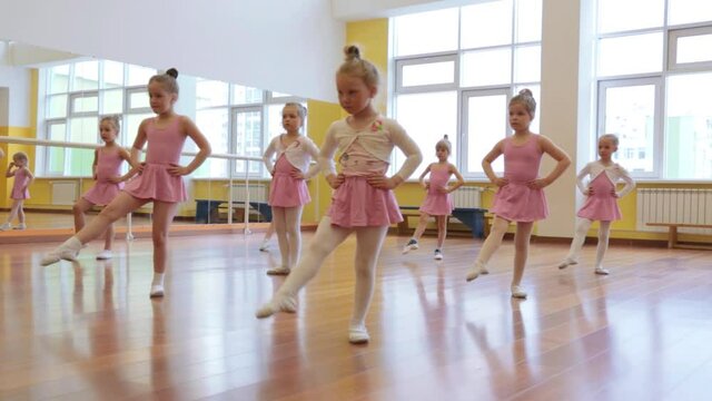 Group of little girls practicing in ballet school