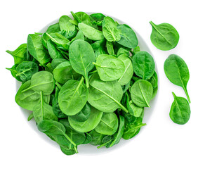 Fresh spinach leaves in bowl isolated on white background. Macro. Top view. Flat lay..