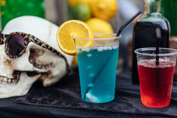 Multicolored alcoholic and non-alcoholic cocktails with straws