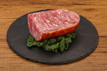 Beef ham piece over board