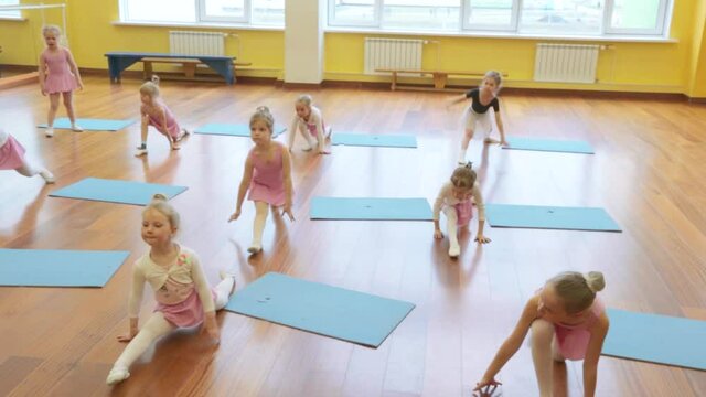 Group of little girls practicing in ballet school