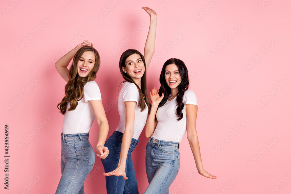 Wall mural Profile side photo of three young excited girls happy positive smile crazy have fun isolated over pastel color background