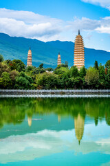 Vertical view of Dali Three Pagodas of Chongsheng Temple with water reflection and blue sky Dali...