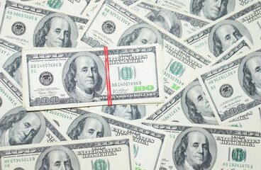 One hundred dollars pile on 100 dollars  background. Money concept  and finance. Business background