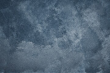 Navy blue painted old shabby wall texture. Dark indigo rough gloomy abstract grunge background