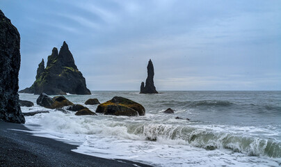 The Reynisdrangar basalt rocks at Reynisfjara Black Sand Beach, Iceland, Europe