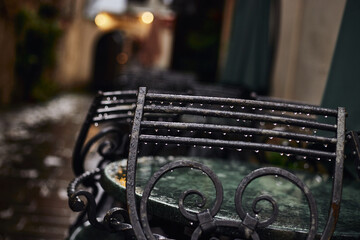 Rainy street cafe in old European town. Summer rainy day at Lviv, Ukraine.