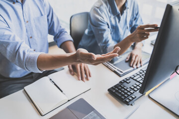 Programming developing software application. programmer writing program code with two monitors and working hacker on a new software