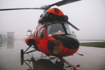 A small airfield with airplanes. Aircraft details. Old helicopters