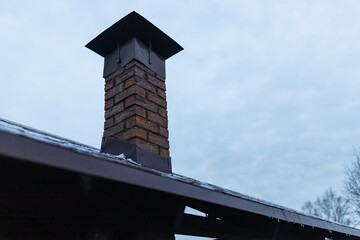 the interior of an old brick house. cozy private country house with muted lighting in dark colors