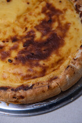 Parisian Flan, cutted classic tart served on a plate copy space. High quality photo