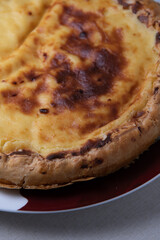 Parisian Flan, cutted classic tart served on a plate copy space. High quality photo