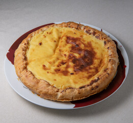 Parisian Flan, cutted classic tart served on a plate copy space. High quality photo