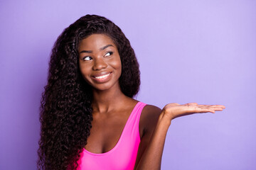 Photo of young black girl happy smile dream look empty space present product advert offer isolated...