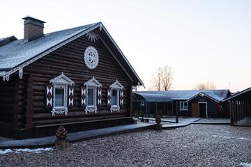 wooden house with decorative carved shutters on the windows. the facade of a country holiday home...