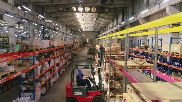 Work forklift in a modern warehouse. Large modern warehouse panoramic view