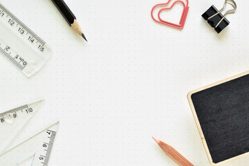 Top view, Dots paper for designers with black pencil, ruler, paper clip and blackboard is elements.