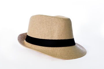 Panama model hat, straw hat with black ribbon isolated on white background.