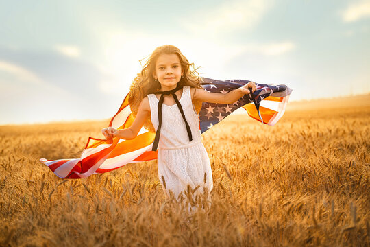 Adorable patriotic girl in white dress wearing an American flag - Powered by Adobe