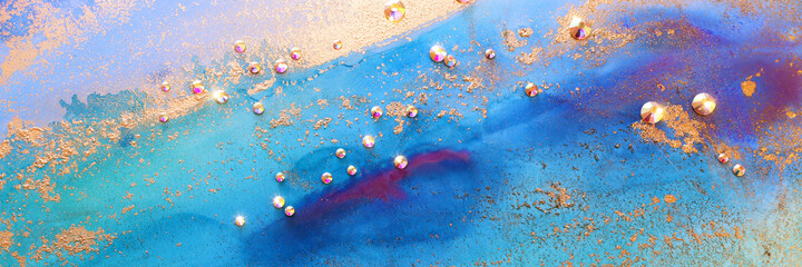 art photography of abstract fluid art painting with alcohol ink blue, aqua, gold colors and crystal rhinestones