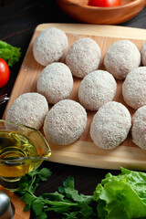 homemade natural farm cutlets on the table with vegetables and herbs.